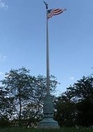 This photograph of the World War I Memorial Flagpole in a shot where it stands today in Juneau Park in Milwaukee, Wisconsin.