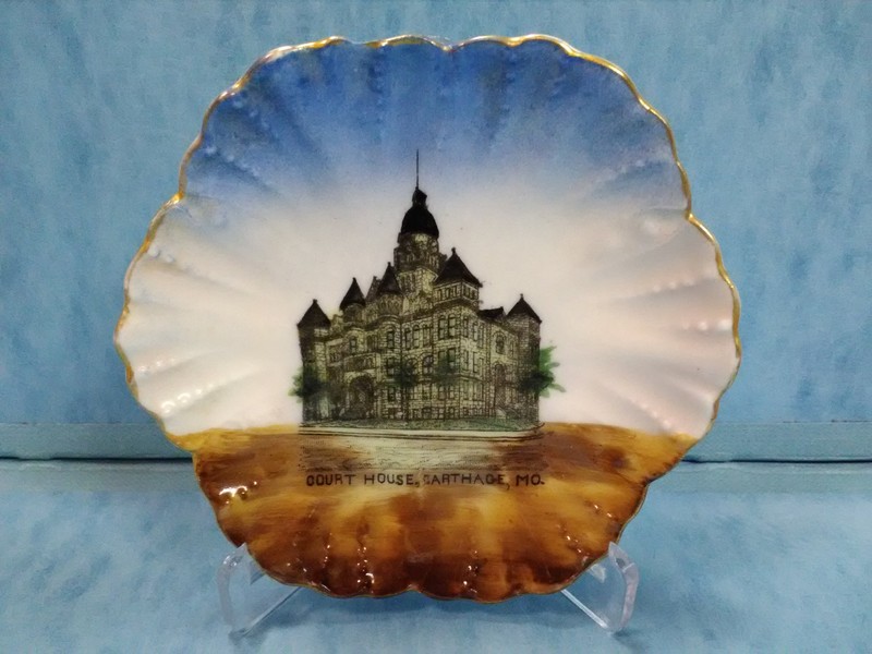 Front of pin dish sold in W. T. Roach store at this location. The hand-painted decoration features an image of the Jasper County Courthouse built in 1894-95.