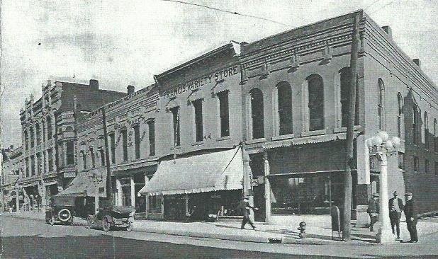 Image of facades of older buildings (left of the McDaniel Building at the right corner) that became incorporated into the Steadley Building in the late 1920s. The historic image is from the 1910s.