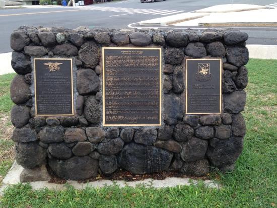 The back side of the monument displays three plaques. Names of SEALs, Operation Red Wings description, and  names of Night Stalkers.