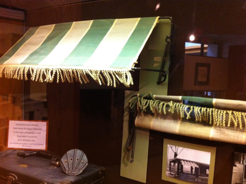 H. E. Williams window shades for automobiles on display in 175th Anniversary of Carthage 2017 Exhibit at the Powers Museum. Shades are from the museum's collection.