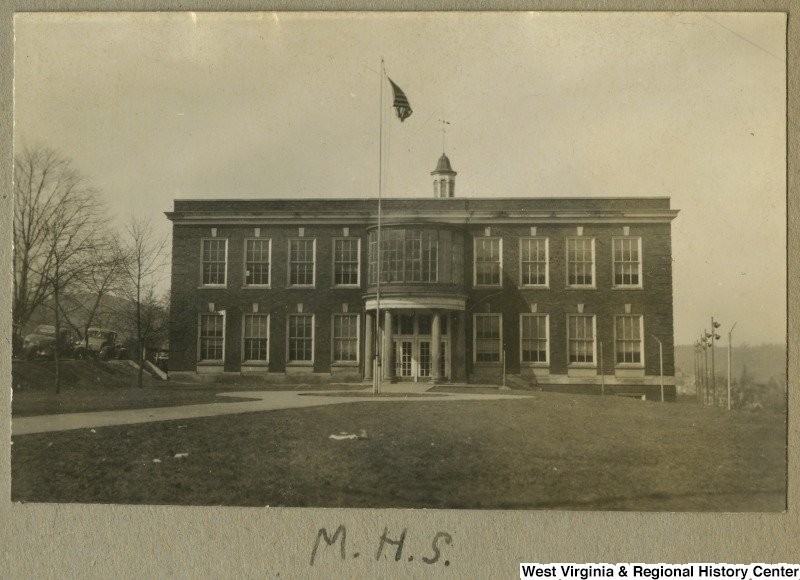 Photograph featuring the first constructed building of the complex. This front facade is currently the indoors and integrated into the main lobby. ca. 1940. Courtesy of the West Virginia Regional History Center.