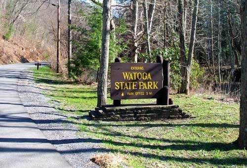 Pictured is the entrance sign to Watoga State Park, which notifies visitors that the park office is 5 miles from that point. 