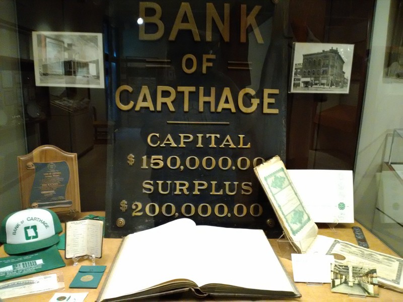 Bank of Carthage items including one of two building signs owned by the Powers Museum on display for the 175th Anniversary of Carthage Exhibit in 2017. 