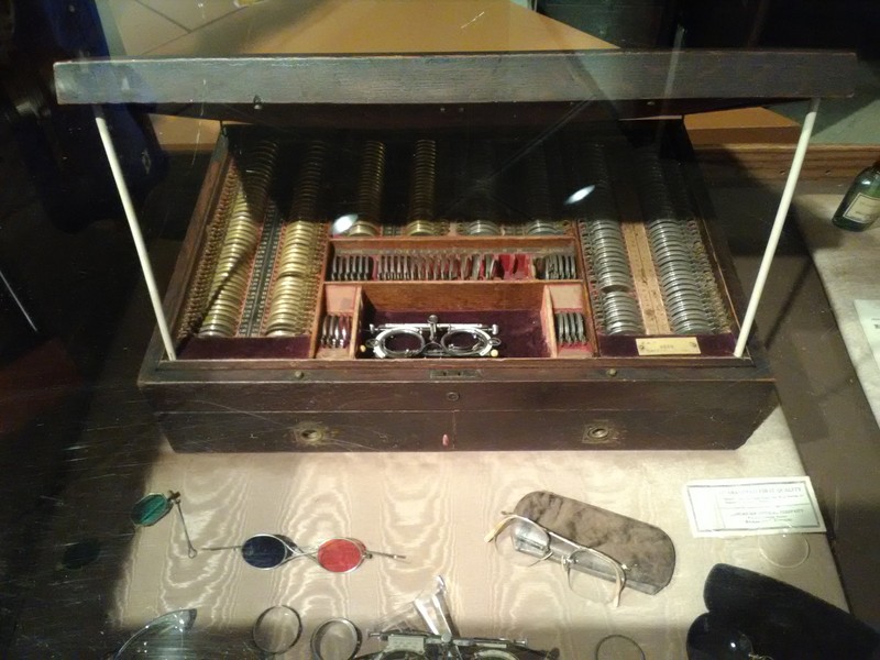 Dr. Powers' oak case of lenses to fit patients for new glasses used in his second floor office in the Bank of Carthage building as seen in 2017 museum exhibit.