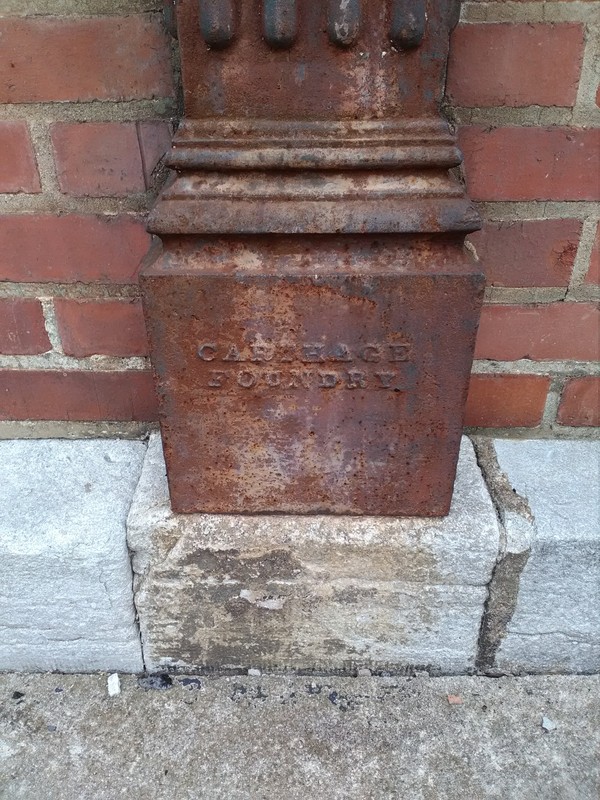 Carthage Foundry name at bottom of cast iron pillar details.