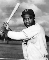 A famous snapshot of Jackie Robinson at bat playing for the Brooklyn Dodgers.