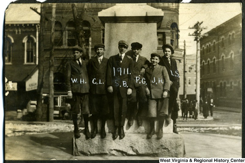 Photo of boys at the foot of the Statue in 1911. Courtesy of the West Virginia Reginal History Center.