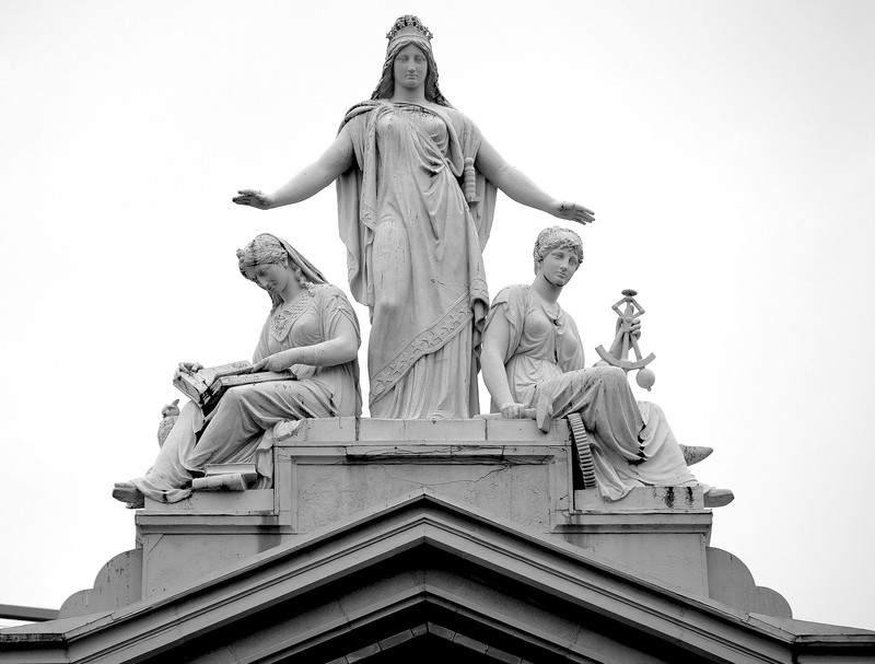 The statue atop the Arts and Industries building depicts Columbia protecting Science and Industry. Photo by Jamieadams99 on Wikimedia.