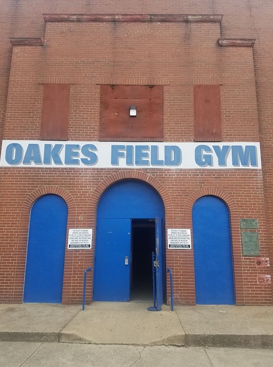 The entrance facade of the Oakes Field Gym, which houses the accompanying basketball court and support facilities. The Works Progress Administration constructed many such facilities around the country during the Great Depression.