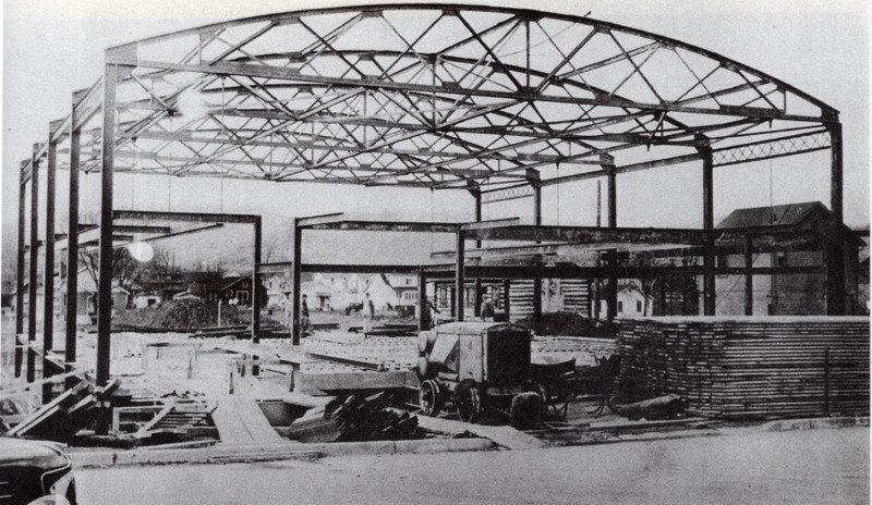 The neighboring Oakes Field Gymnasium being built in 1939, which preceded the construction of the field. The field occupies the space between the Gymnasium and the Charleston Naval Ordnance Center.