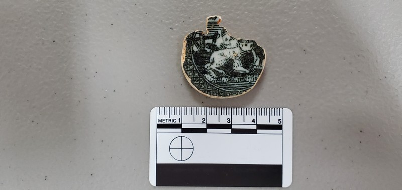 A game piece fashioned from a broken punchbowl, manufactured between the late 18th century or early 19th century, was discovered during an excavation at Mead's Tavern.