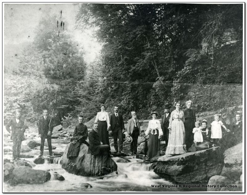 Guests of the Webster Springs Hotel visit the Elk River behind where the hotel stood.