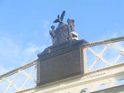 Statue Over Bridge