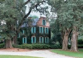 Sideview of the Medway Plantation sorrounded by trees.