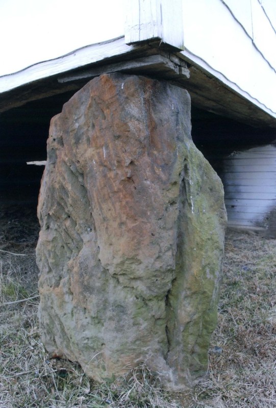 One of the boulders that the building rests one.  