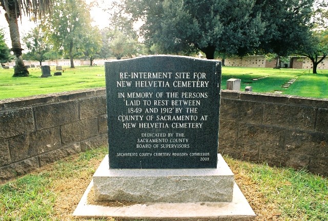 A marker identifying the reburied remains West Lawn Memorial Park.