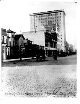 4th Ave looking west, with the bank in the background, circa 1925