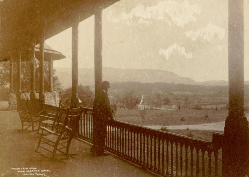 A visitor stares off to the South in this early picture from the building.