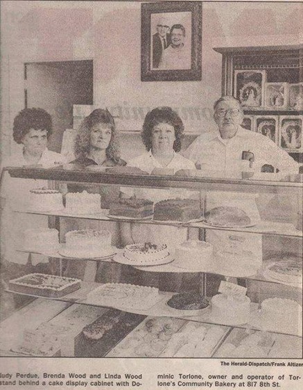 Dominic Torlone and staff behind the counter