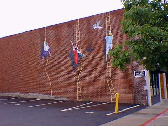 Exterior wall of the museum, which shows several pirates climbing the wall (Photo courtesy of the New England Pirate Museum)