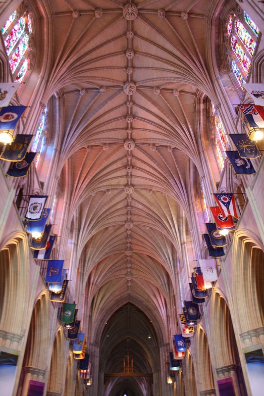 State flags hang from the nave of the Cathedral. Photo by Mina Elias, Wikimedia.