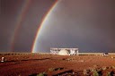 The UFO Watchtower featuring a double rainbow.