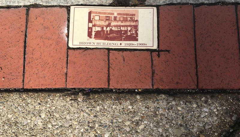 A historical brick placed by the West Virginia Center for African American Art & Culture;  marking the corner of Washington Street, East & Shrewsbury Street on "The Block";  original site of Anderson H. Brown Building, 1920-1960.