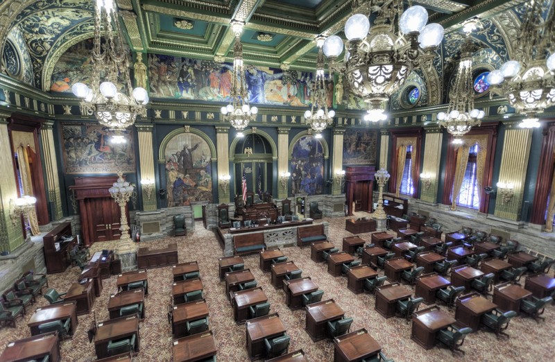 The ornate Senate chamber features murals by Violet Oakley...