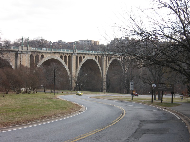 The Taft Bridge connects two neighborhoods separated by Rock Creek Park. Its arches are reminiscent of a Roman aqueduct. Photo by Michiel1972, Wikimedia.