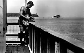 A fisherman fishing off Stiltsville back in the day. 