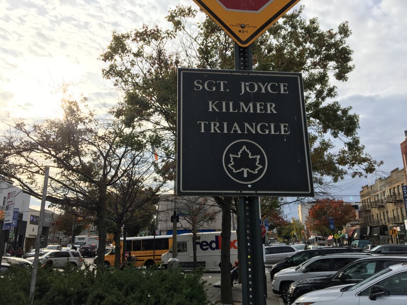 A sign placed by the Parks Department. The square is a quite place between two busy thoroughfares