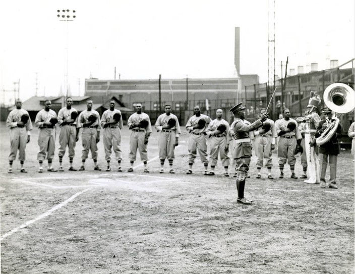 A band performs the Star Spangled Banner prior to the start of a 1940s Philadelphia Stars game at Penmar Park