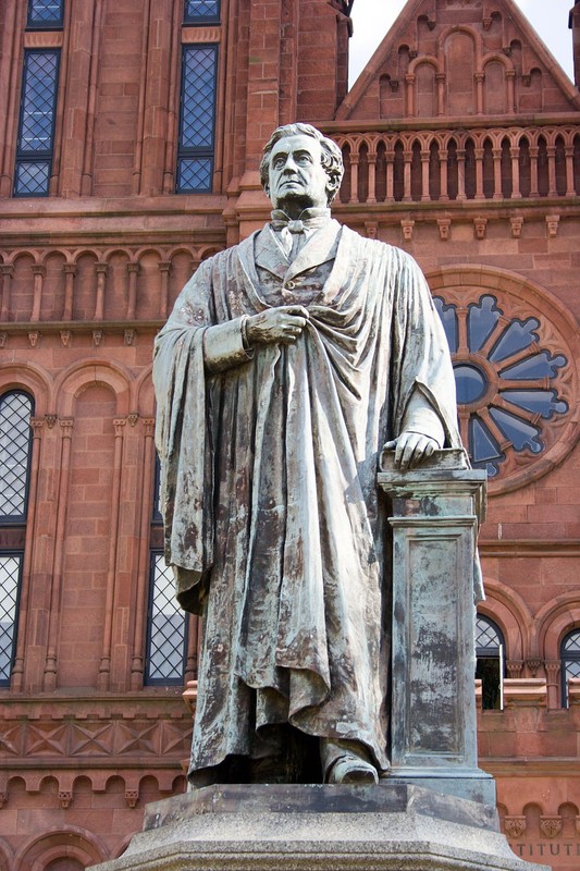 Joseph Henry stands in front of the Castle and looks out at the National Mall. Photo by David Bjorgen, Wikimedia.