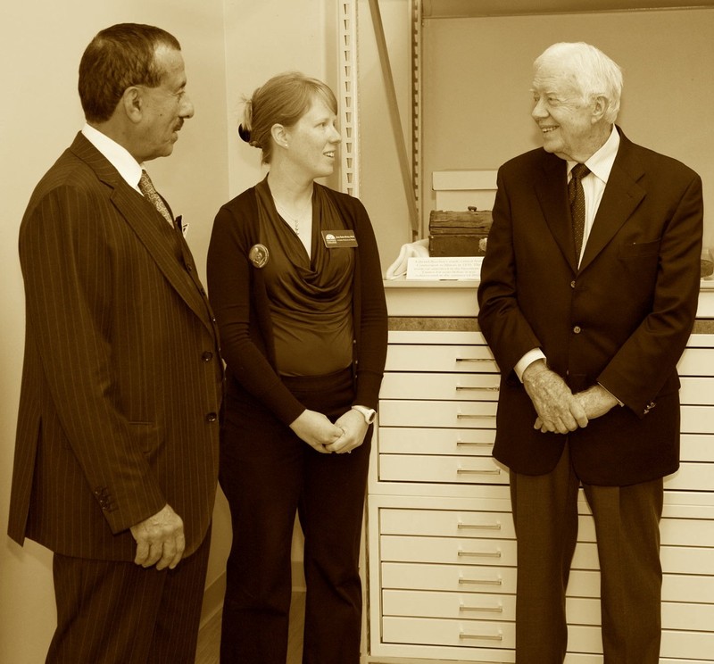 This picture shows Dr. Khalaf Al Habtoor (left), Professor Jenny Barker-Devine (middle), and former president Jimmy Carter on the day the archives where dedicated. Taken from within the archives.