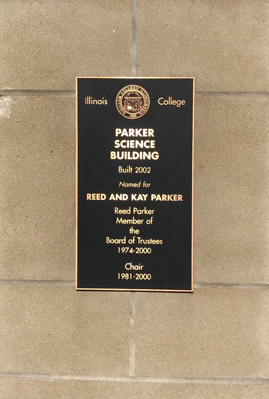 This plaque is on the front of the building that showcases who the building was dedicated to and what he did for the campus.