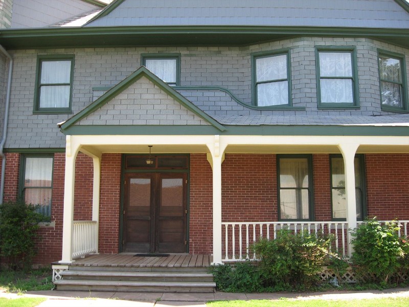 Front of the mansion showing the double door entryway.