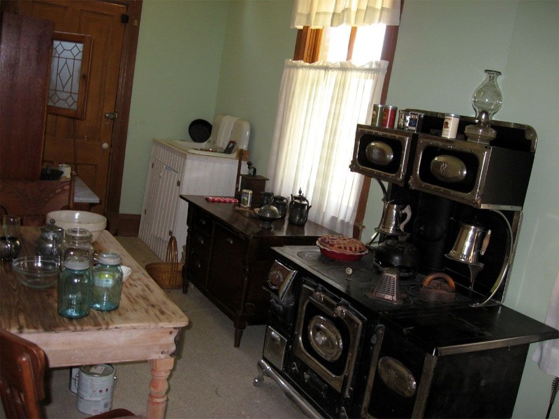 This kitchen is located in the A. J. Seay Mansion and it connects to the dining room as well as the parlor. 