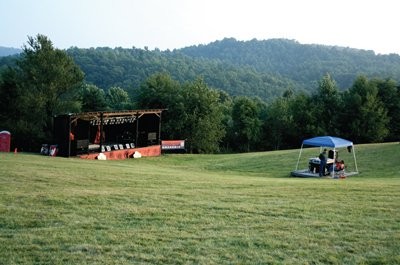 The stage in the large field used for performers to share their talent for travelers, locals, and visitors to the area.