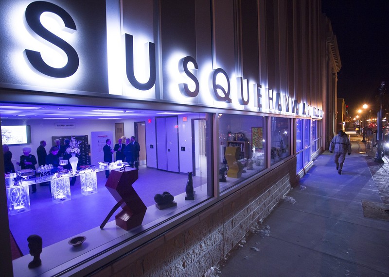 SAM lit up at night while patrons inside enjoy its latest exhibit.