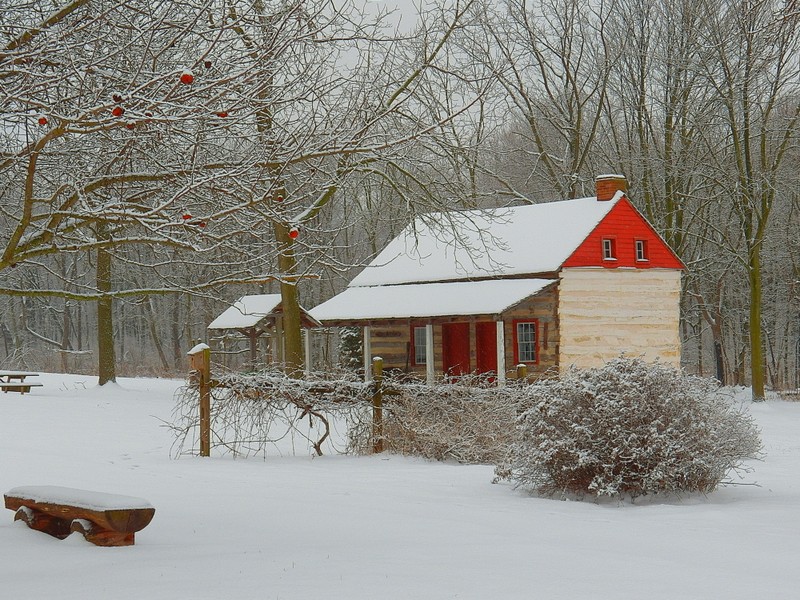 Negley Log House (c 1830) in winter. This original structure burned in a devastating fire February 2016. A replica was rebuilt the following year sourcing local materials. 