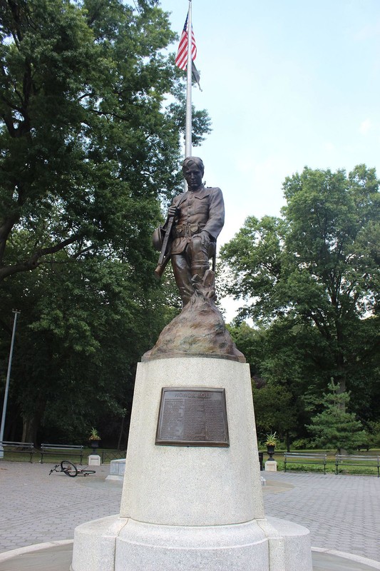 Forward facing photo; "Honor Roll" and plaque and flagstaff now visible