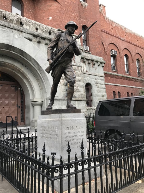 Left side of statue- on 8th Avenue side of building