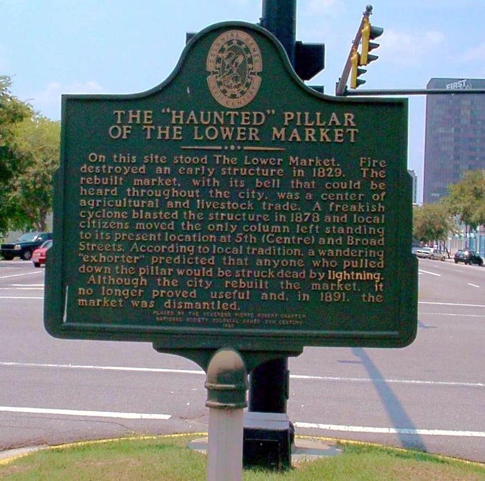 This historical marker designating the location of the former market and the "Haunted Pillar" was dedicated in 1996.