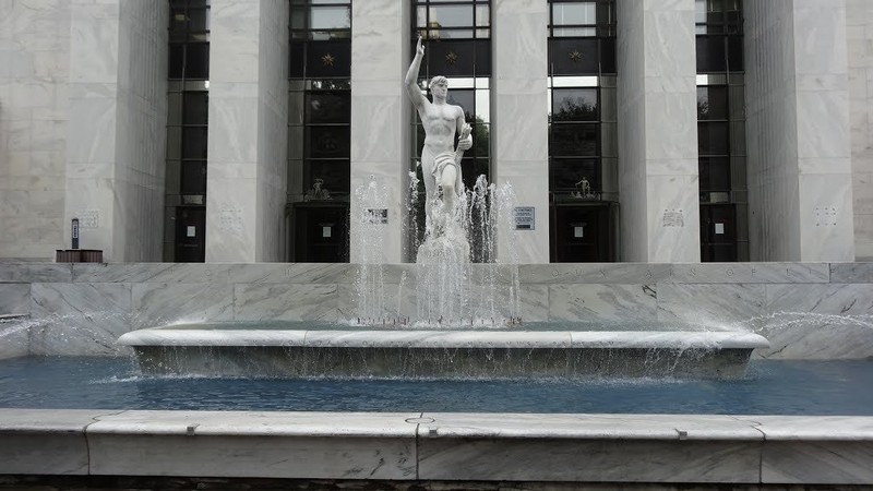 The fountain and 12-foot marble statue at the Front Street entrance to the courthouse.  