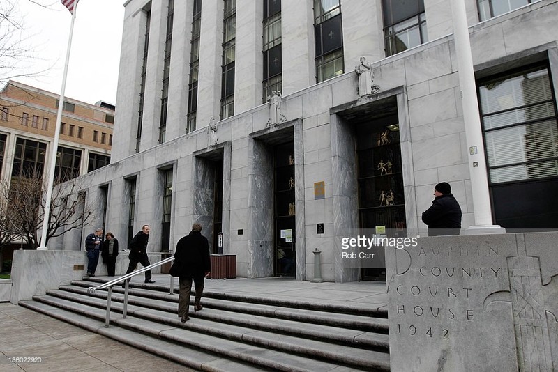 People head up the stairs to the Market Street Entrance to the courthouse.  