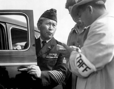 An unidentified navy veteran of Japanese ancestry reports to the assembly center for processing.