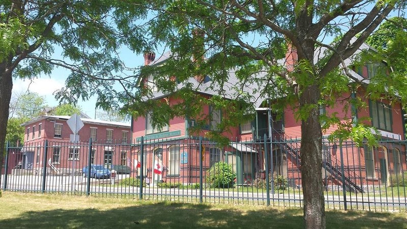 The Mill Museum's buildings: an 1877 company store and library, and an 1877 warehouse.