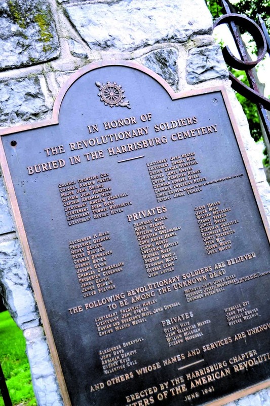 A plaque that commemorates the veterans of the Revolutionary War buried at the Harrisburg Cemetery.  