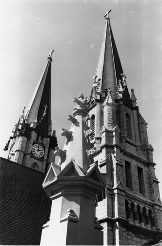 Detailed view of the Gesu Church spire 

Photograph of the Gesu Church, 1977-1978, D-6, series 2.1, Hilltop Photo Collection Box 8, Department of Special Collections and University Archives, Marquette University, Milwaukee, WI.